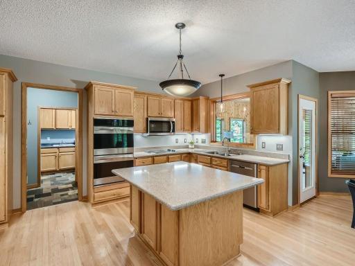 With a large island, quartz counters, oak cabinetry and organizational pullouts.