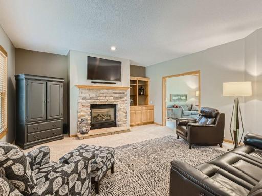 Relax and enjoy the cozy fireplace with stone surround and hearth.