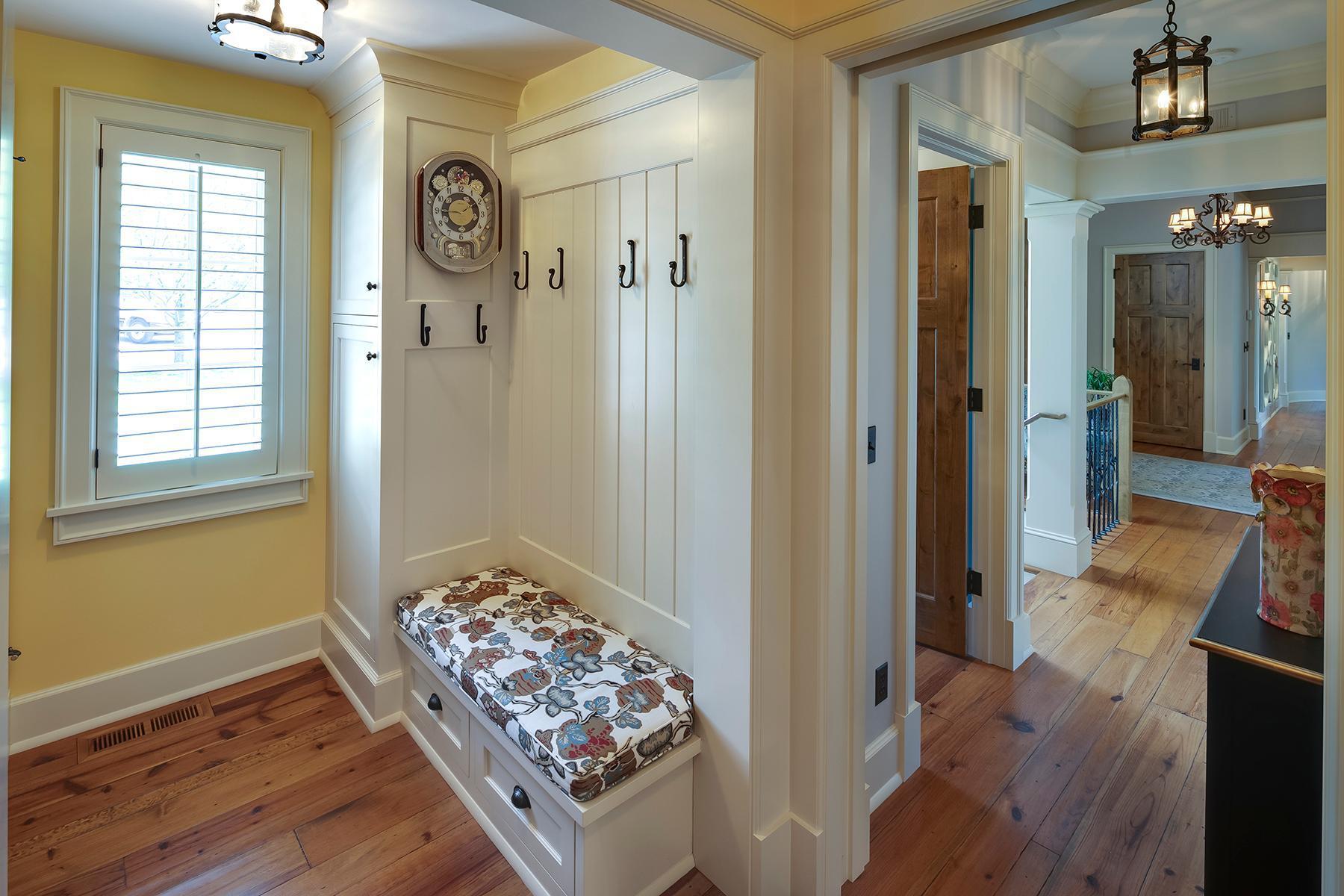 Mud Room with bench and hooks, closet and open to laundry room