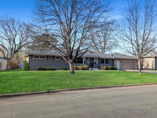 Great curb appeal on this sprawling West Bloomington rambler just steps from Penn Lake!