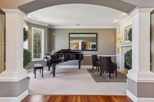 Formal living room or piano room with fireplace