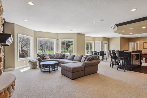 Walks out to spacious fenced backyard with sport court and golf course