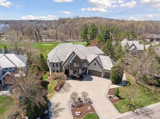 Note the large garage that can house and easy 3 cars and golf cart