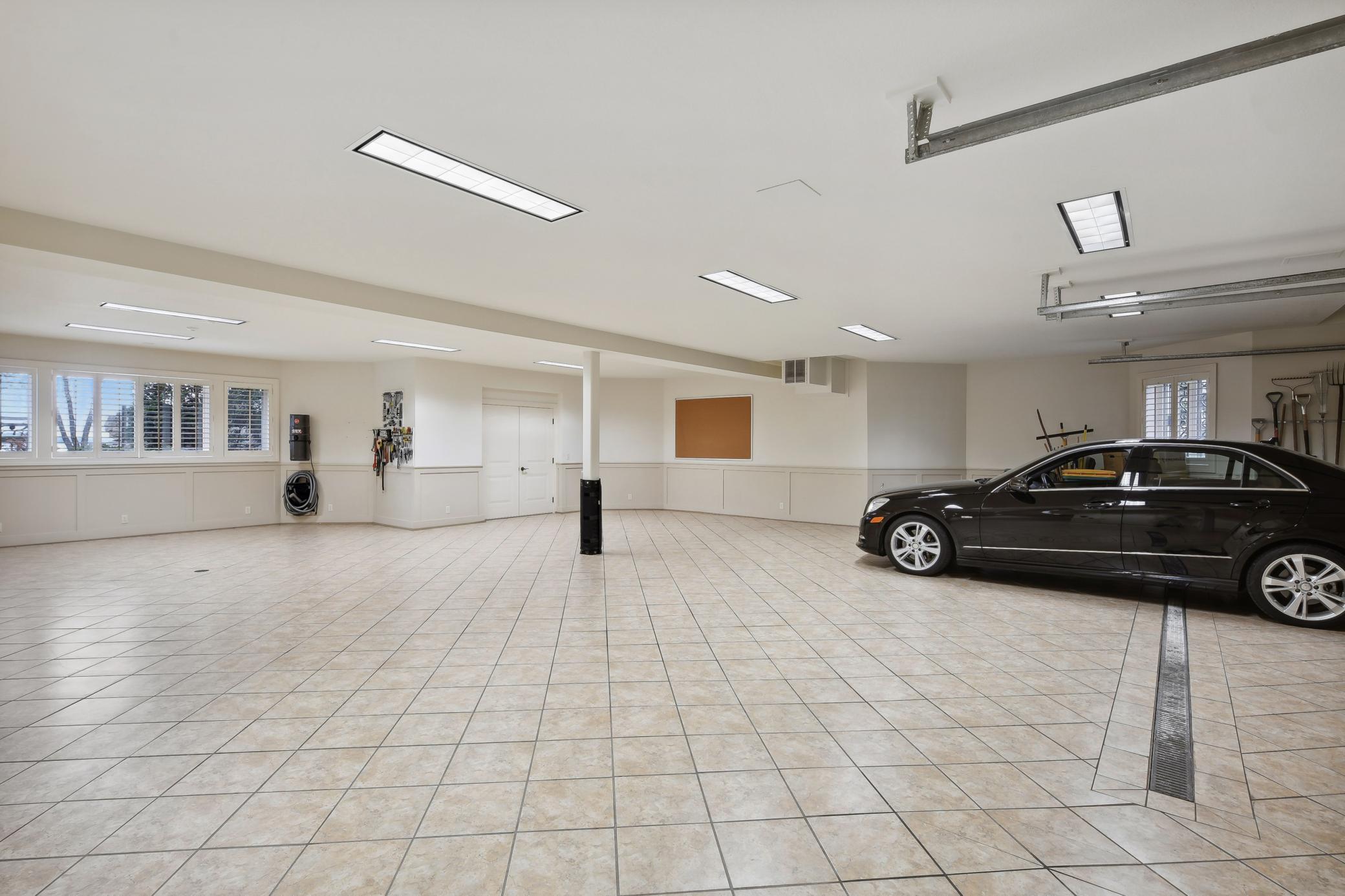 Lower level is a fully finished area that also acts as a garage space
