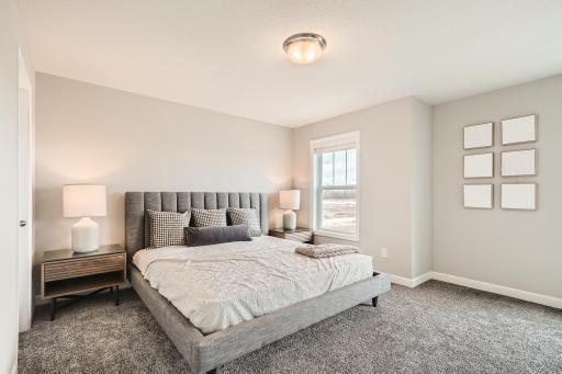 2nd Floor Primary Bedroom- Model home pictured with the same floorplan.