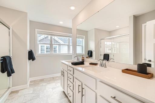 2nd Floor Primary Bathroom- Model home pictured with the same floorplan.