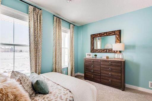 Another view of the front bedroom. Model photo. Options and colors will vary. See listing agent for home specific selections.