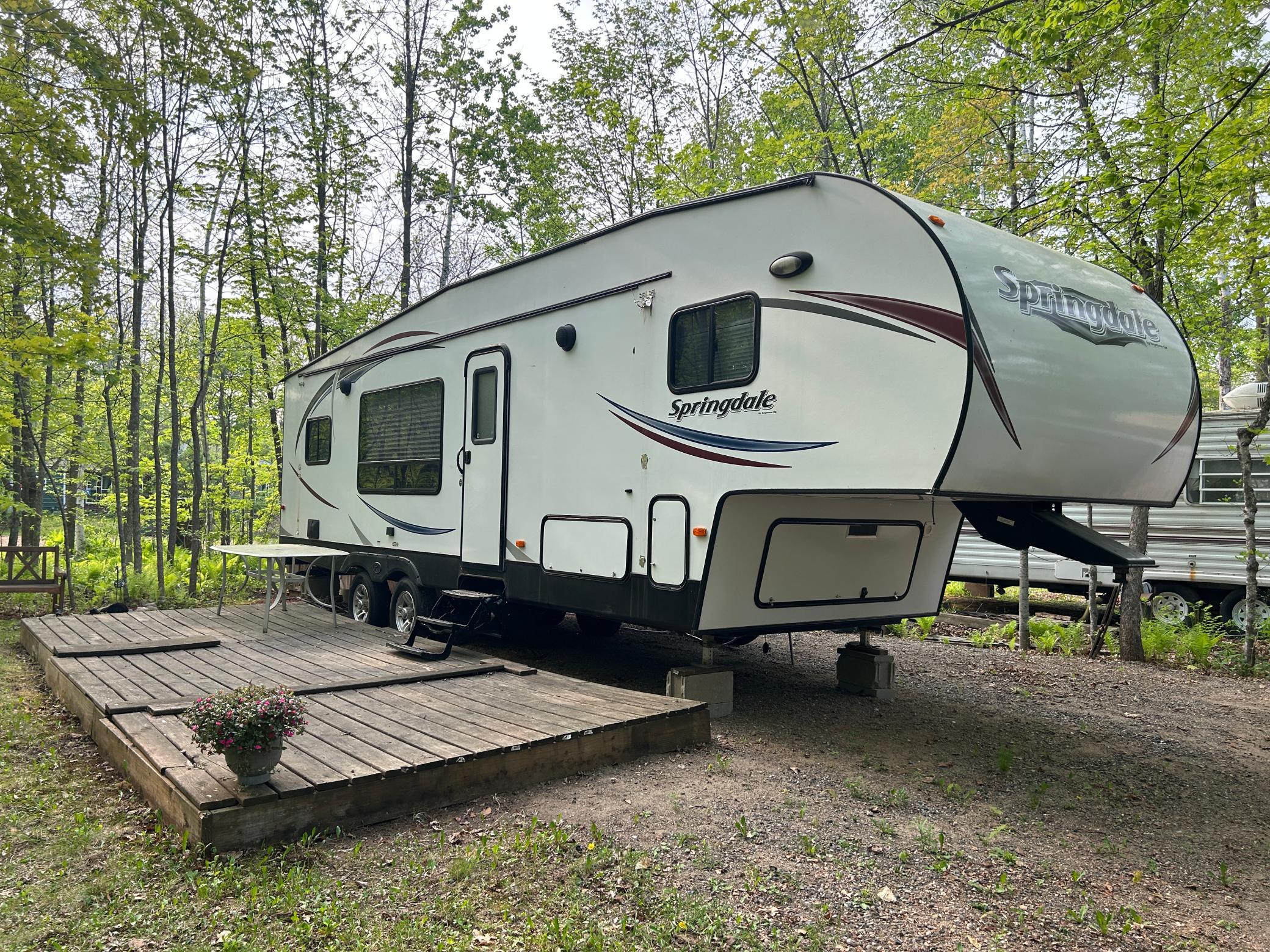 Great camper setup with decking platform - this lot is so lovely in the summer when things green up!