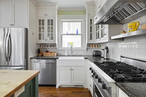 Amazing kitchen with premium appliances, custom cabinets and center island.