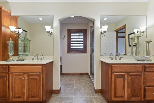 Heated tile flooring expands thru the owners' private bath