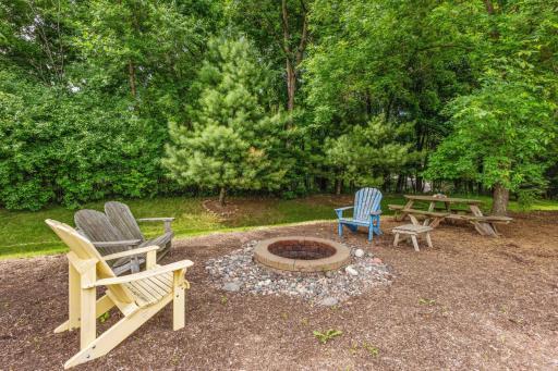 Built-in fire pit set just down from the deck