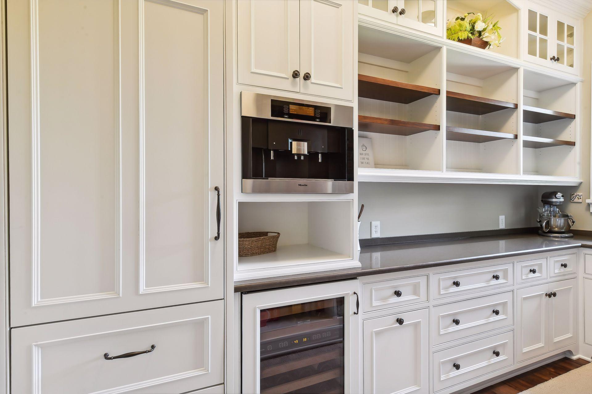 Nestled behind the Kitchen is the Butler's Pantry which offers an upright SubZero freezer with two freezer drawers, a SubZero wine cooler and a built-in Miele coffee maker!