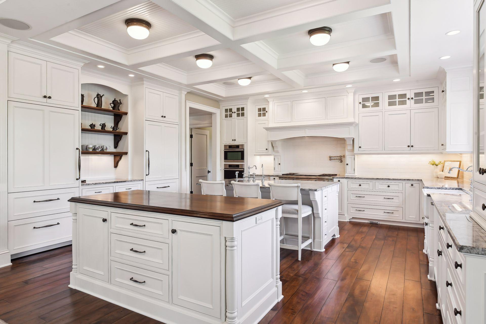 The Gourmet Kitchen features beautifully constructed cabinetry with full-extension, soft close drawers and two SubZero refrigerators with custom cabinet front panels.