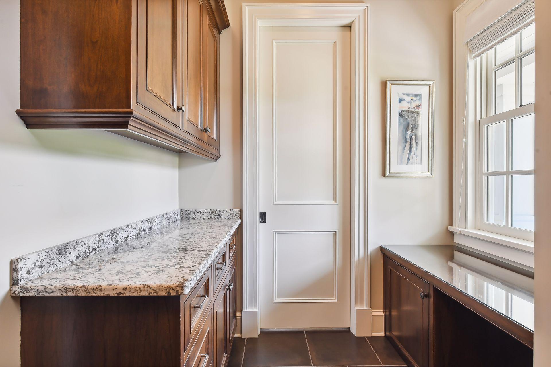 There is a large, walk-in coat closet with custom organizer system and a main level laundry closet for your convenience.