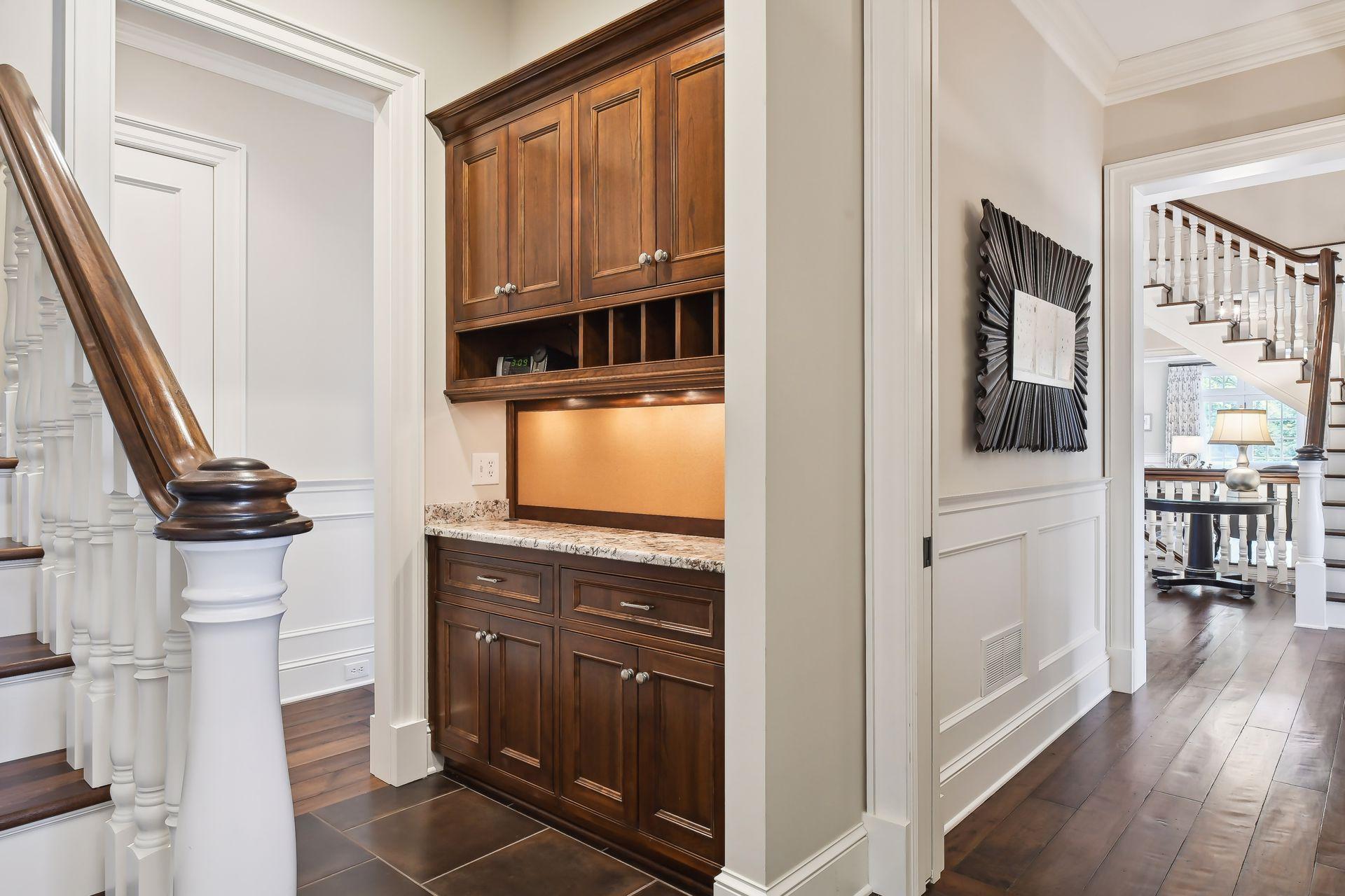 Designed to keep you organized, the Mud Room features two Drop Stations with cabinets, mail cubbies, granite countertops and a corkboard for important messages.