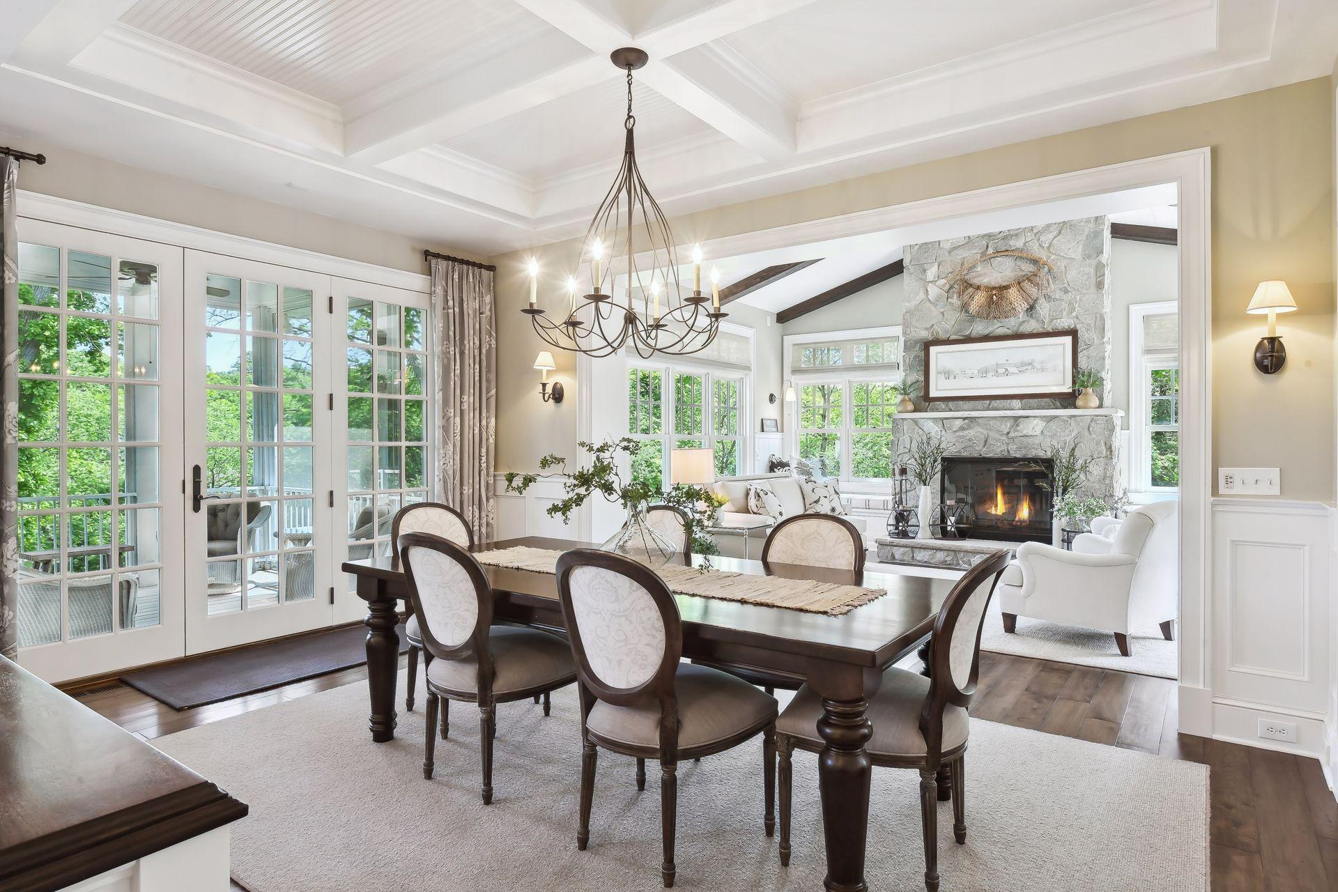A designer light fixture hangs from the coffered ceiling in the eat-in Dining Room.