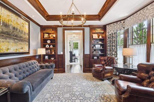 Curl up with your favorite book in the Library which features four built-in cherry bookcases accented with display lighting.