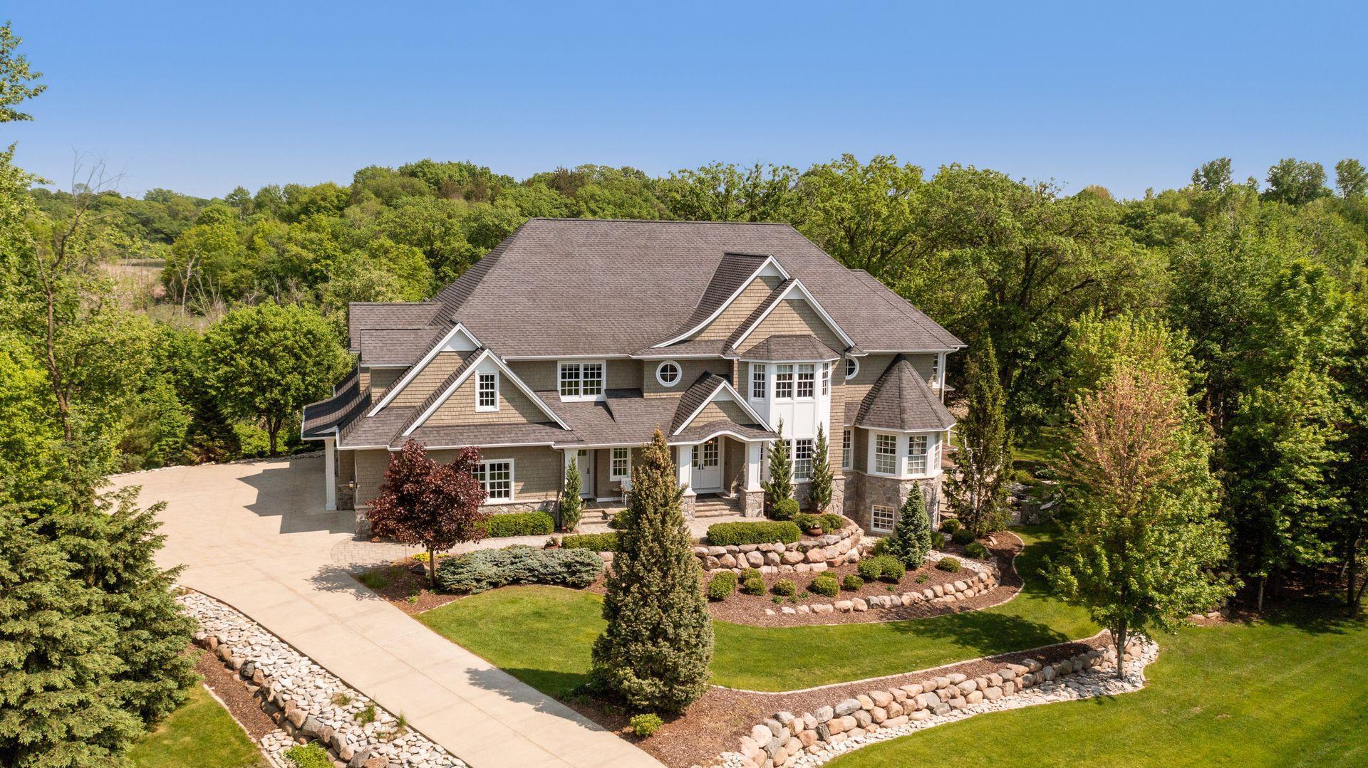 Situated on a private, .75 acre setting surrounded by towering trees and wetlands, this home is a true masterpiece.