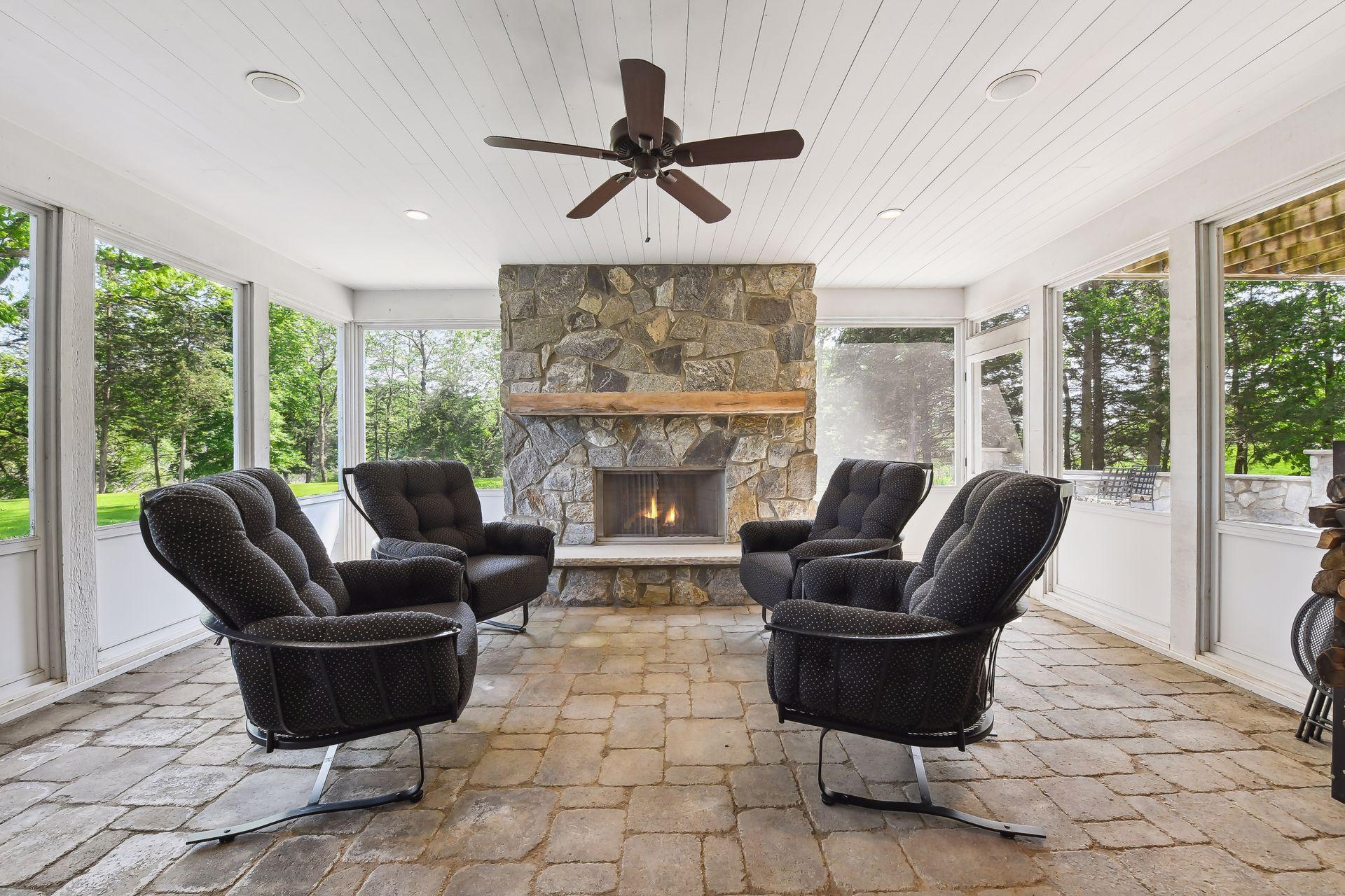 A second Screen Porch is located on the lower level off the Billiard Room and features the home's fifth fireplace.