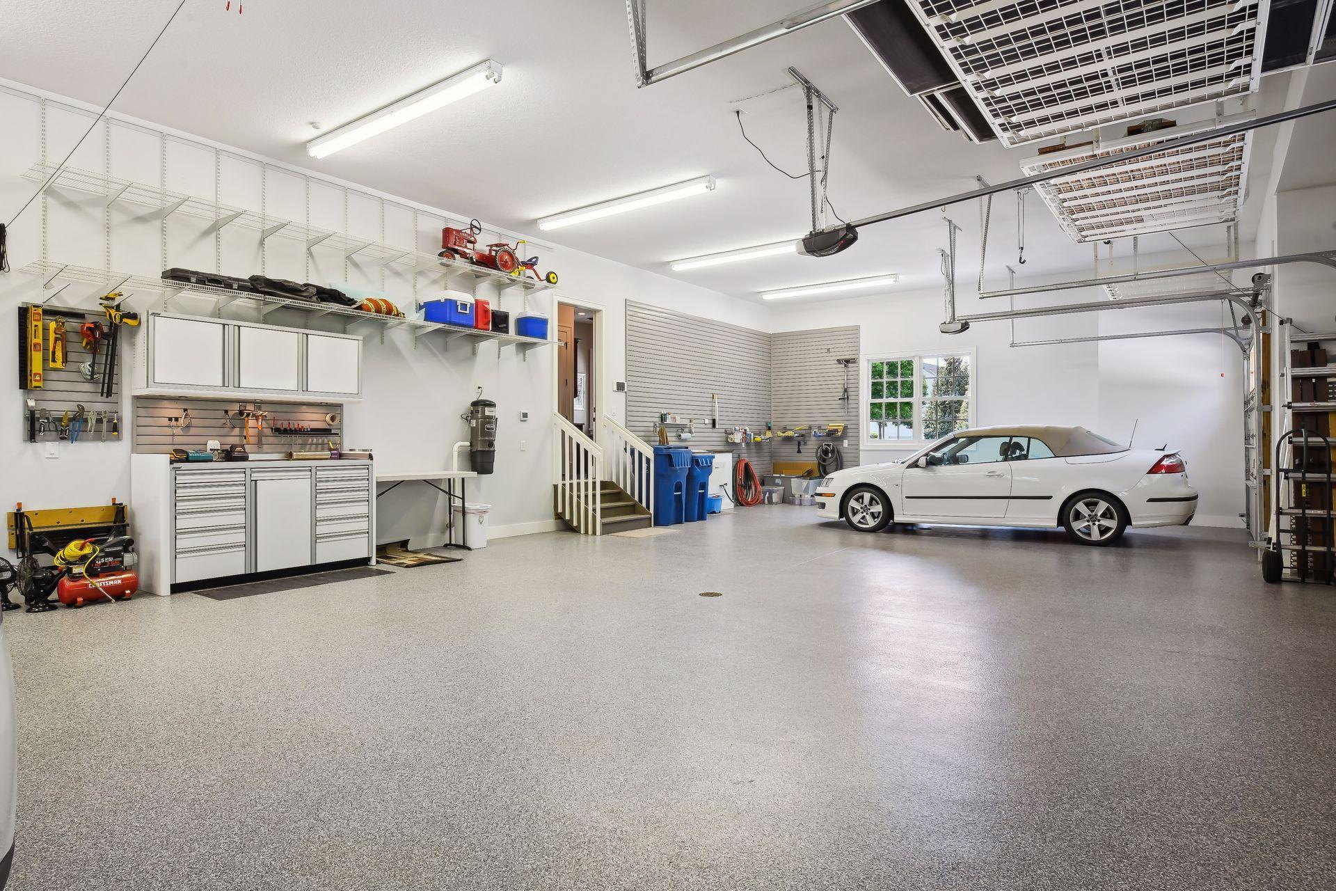The ultimate Garage! This 4 car garage features heated, epoxy floors, in-floor drains and is plumbed with a utility sink and hose bib. With extensive storage options there is even room for your boat or all your toys!