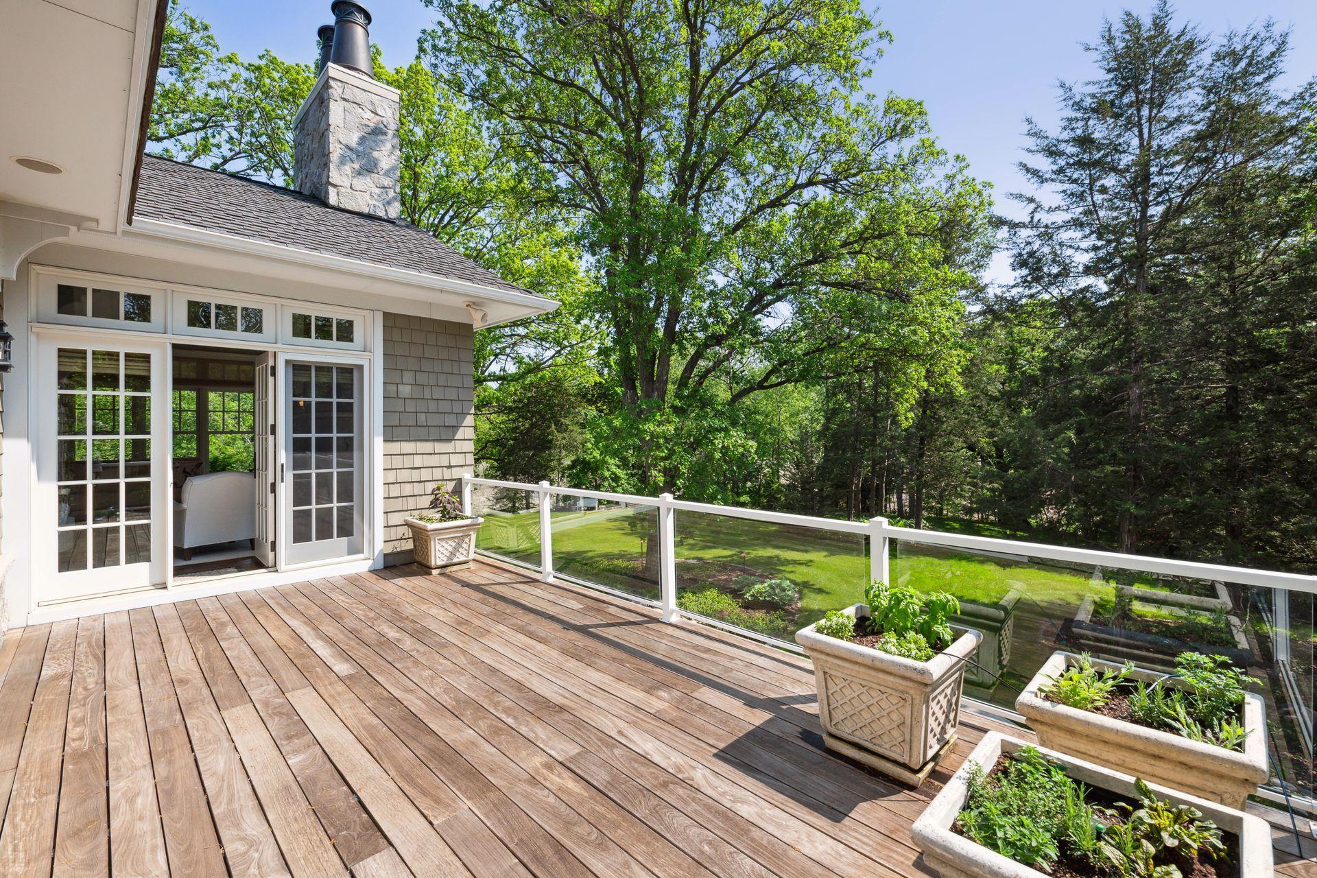 With glass railings, the ipe wood Deck offers uninterrupted views of the surrounding landscape.