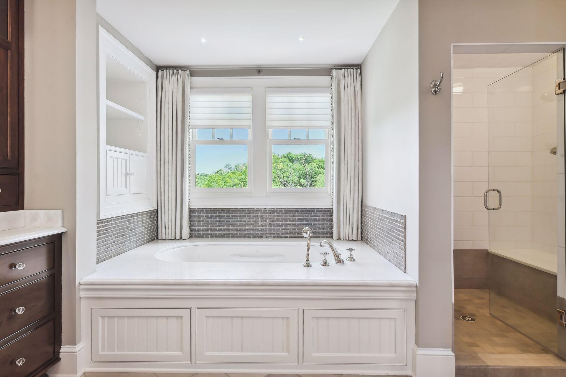 Feel the stress melt away in the large soaking bathtub.