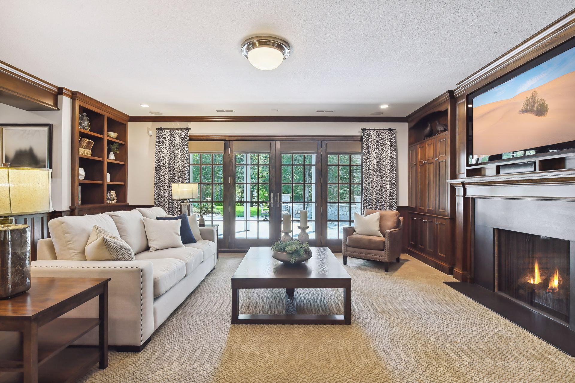 Fully finished and built for FUN! The lower level features a second Family Room with a built-in cherry entertainment cabinetry for DVD’s, books, other storage and a gas fireplace with stone surround.