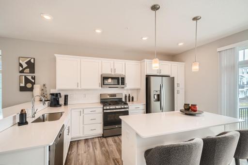 Photo for 7540 38th Street N, Oakdale, MN 55128 - Listing #6368259 Kitchen- Model home pictured with the same floorplan.