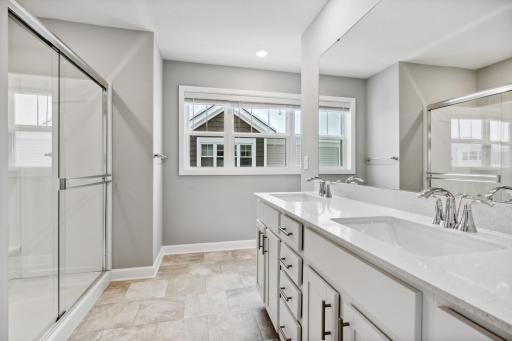 Photo for 7540 38th Street N, Oakdale, MN 55128 - Listing #6368259 Owners suite bath with windows for natural light. Photos are not of actual home. Actual home will be similar. Some colors and features may vary.