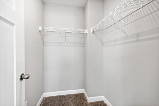 Photo for 7540 38th Street N, Oakdale, MN 55128 - Listing #6368259 First walk-in closet in the owner's suite. Photos are not of actual home. Actual home will be similar. Some colors and features may vary.