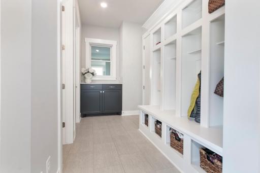 Beautiful locker style coat spaces with built-in storage.