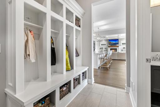 Incredibly functional and cute mud room. Beautiful locker style coat spaces with built-in storage.