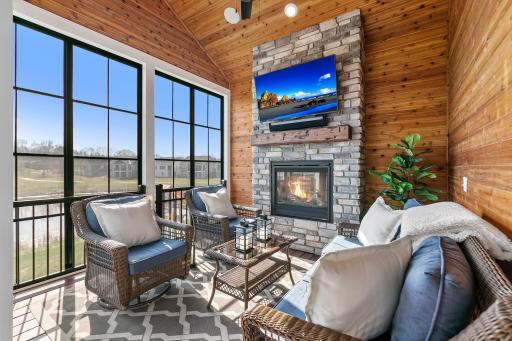 Amazing, cozy four season porch with stone, gas burning fireplace.