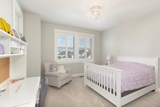 Upper level bedroom with large picture window.