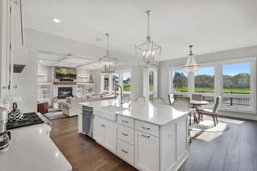 Gorgeous light fixtures and tons of natural light pouring in with a remarkable view of your stunning backyard space