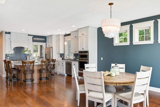 The open floor plan you are looking for! Notice the antiqued leaded glass crystal chandelier in the dining rm and KitchenAid appliances throughout the kitchen featuring built-in convection microwave, convection oven w/ separate warming drawer.