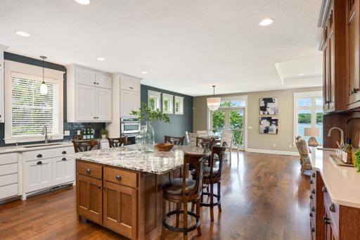 3/4" tongue & groove solid white oak hardwood floors throughout most of the main floor. Center island has a granite countertop, electric outlets, tons of storage and soft-close doors, drawers and pullouts.
