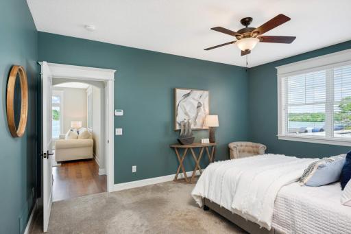 The wall straight ahead can easily be opened to expand the primary suite area, or add French doors between the primary bedroom and main floor office (on the other side of the wall). Wall is framed for French doors to be added if one desires.