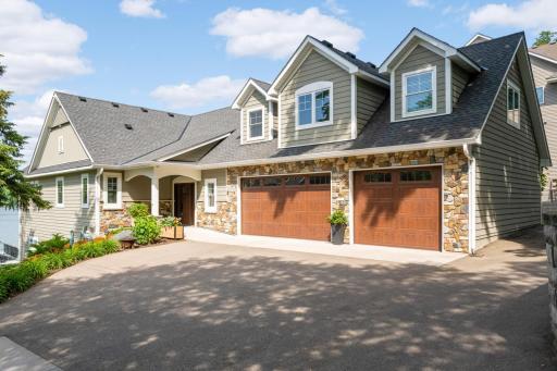 Welcome to 1576 Finch Lane located on Lake Minnetonka in Mound! This stunning custom built walkout rambler has 101' of owned lake shore, plus plenty of space in the oversized 3 car garage and side parking to store all of your toys.