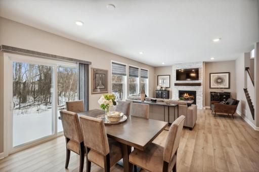 Photo for 6613 Coach House Lane, Corcoran, MN 55340 - Listing #6369342 Another view of the main level highlighting all the natural light with generous use of windows. Photo is of model home. Color and finish can vary.