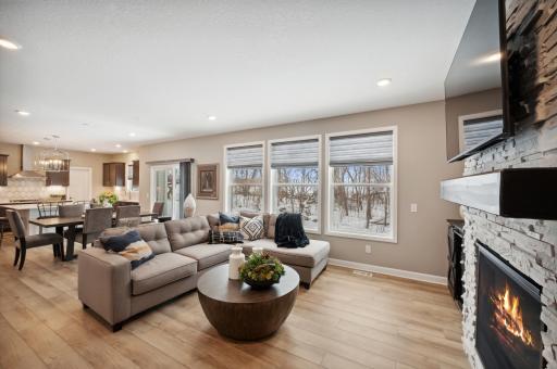 Photo for 6613 Coach House Lane, Corcoran, MN 55340 - Listing #6369342 Another view of the family room with luxury vinyl plank floors. Photo is of model home. Color and finish can vary.