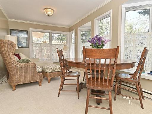 SITTING ROOM OR DINING ROOM WITH CEILING TO FLOOR WINDOWS