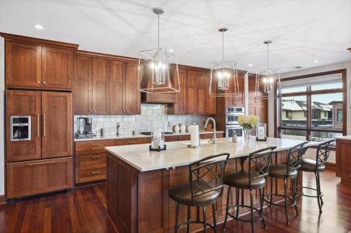 Beautiful custom cabinets and a large center island are highlights of the kitchen