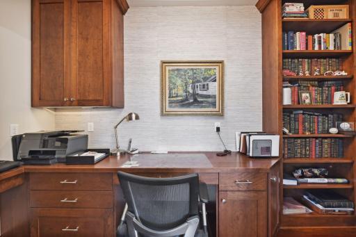 A pocket office with built-in desk and storage is located just off the kitchen