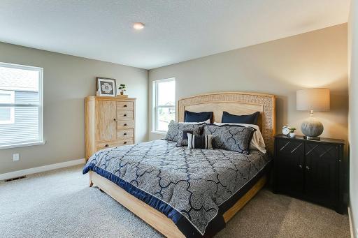 The home's second level starts with this oasis of a primary suite!! (Photos of the same floorplan, colors will vary)