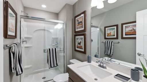 Private 3/4 bath to one of the upper level bedrooms. *Please note, photos are not of actual home, but of a model. Colors and features will vary in actual home.