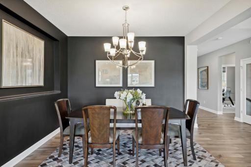 Dining room. *Please note, photos are not of actual home, but of a similar model. Colors and features will vary in actual home.