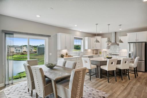 Kitchen eating area. All cabinets will be white. *Please note, photos are not of actual home, but of a similar model. Colors and features will vary in actual home.