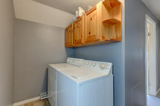 Also a laundry room with overhead cabinets for your laundry and cleaning supplies!