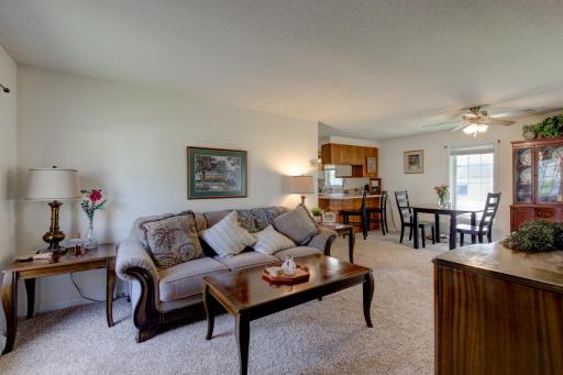 As you enter this home, you're greeted by an open living space that flows into dining and kitchen.